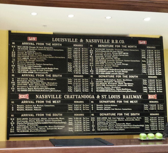 Railroad schedule still hangs on the wall behind the lobby - Union Station Hotel Nashville